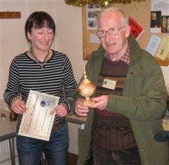 The monthly winner John Brocklehurst received his certificate from Carlyn Lindsay